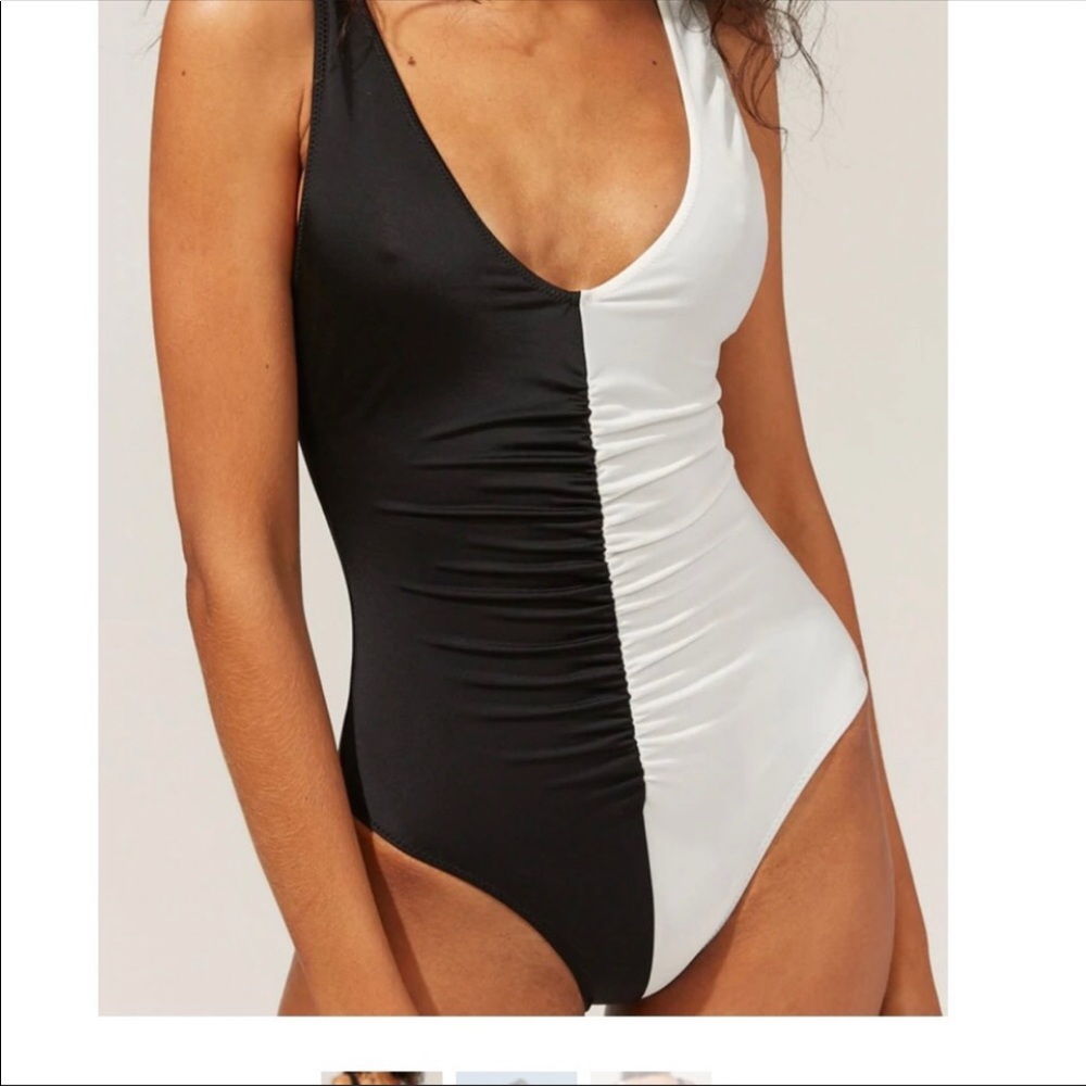 BRAND NEW solid and striped swimsuit. Black and white so cute!!!